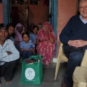 Michael Manser and his Neem Tree Trust bag with a weaving family in Savlas in Gujarat